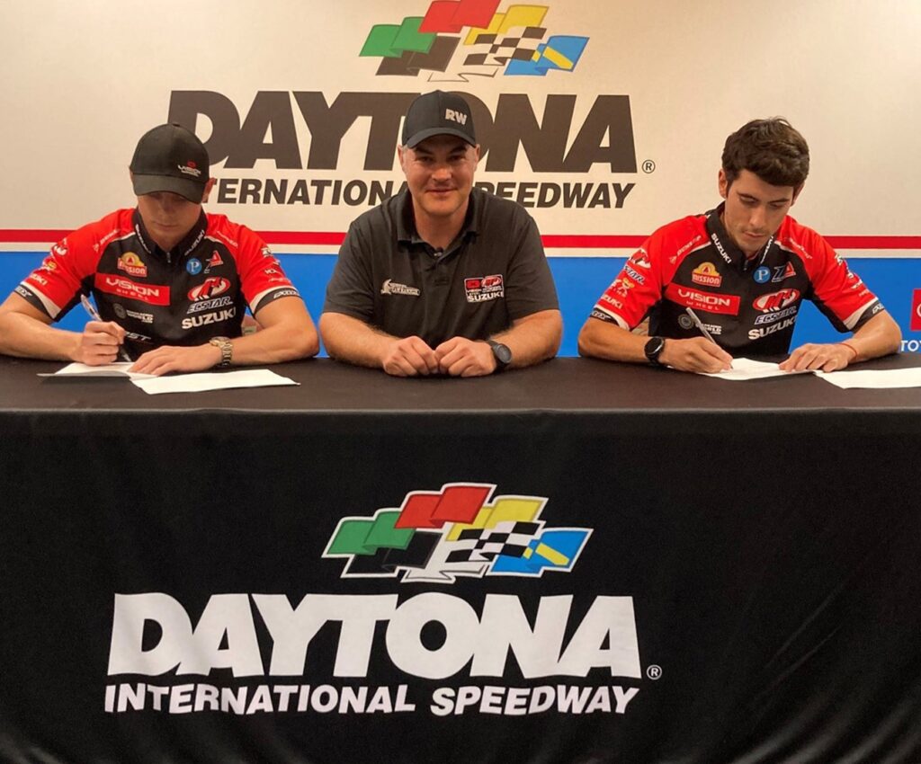 Tyler Scott (Left), Chris Ulrich (Center) and Richie Escalante (Right) complete the signing process within the historic walls of the Daytona International Speedway.