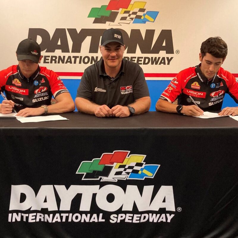 Tyler Scott (Left), Chris Ulrich (Center) and Richie Escalante (Right) complete the signing process within the historic walls of the Daytona International Speedway.